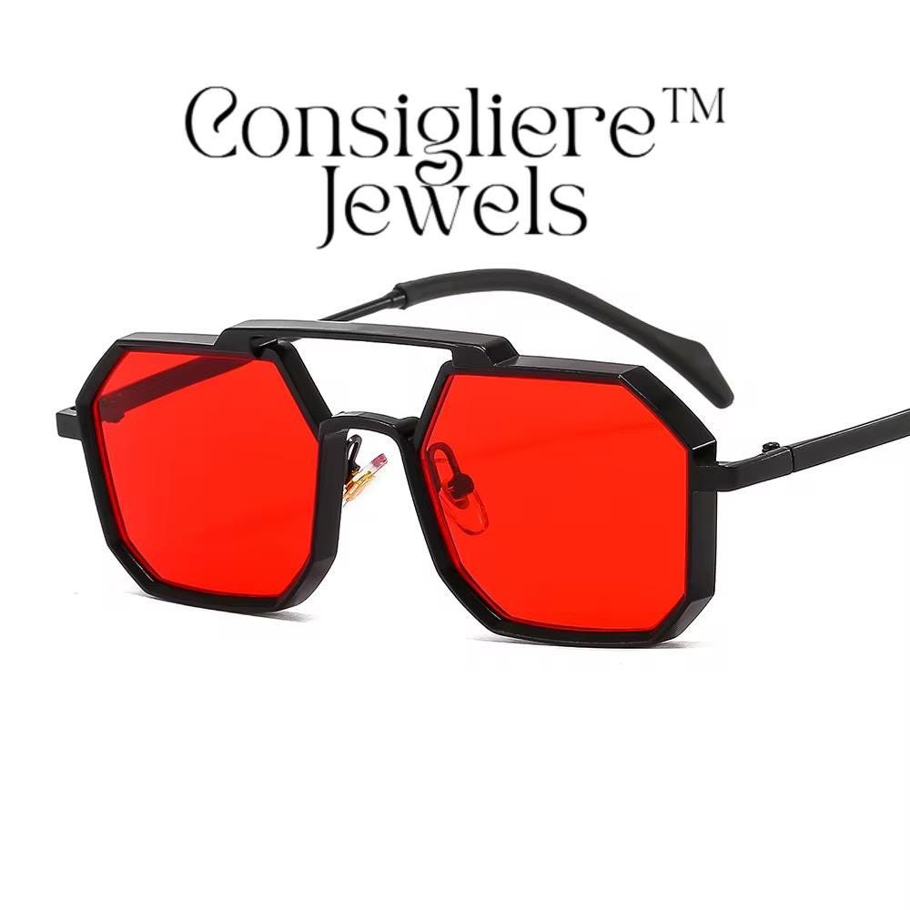 The Consigliere™ Jewels Luxury Sunglasses are stylish and classic unisex sunglasses featuring a black metal frame with polycarbonate lenses that provide UV400 protection. The sunglasses are personalized with laser engraved branding, making each pair unique. With a polygonal design theme reminiscent of the 80s and 90s, these sunglasses offer a touch of old-school charm in a modern frame. The temple length is 151mm, making them comfortable and fashionable for everyday wear.